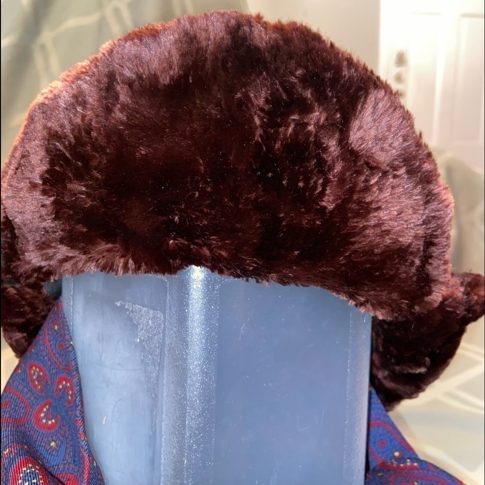 Luxuriant Beaver fur hat with brow, side and back flaps can be worn up or down.
